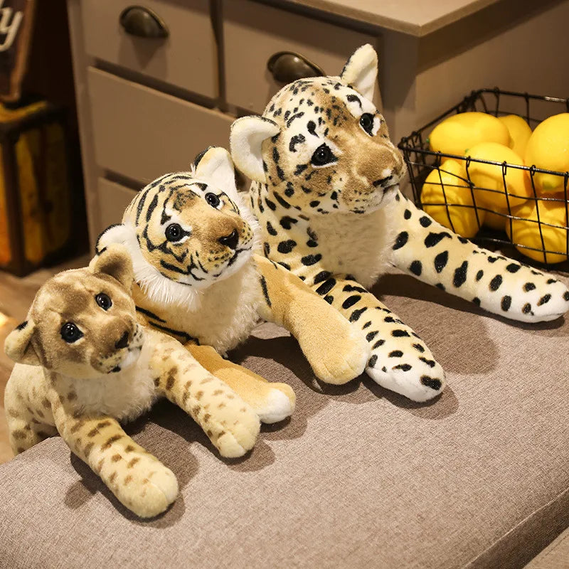 Three adorable plush animal toys featuring lifelike designs of wild animals, displayed on a wooden surface. Perfect for play, decor, or as a cuddly companion.