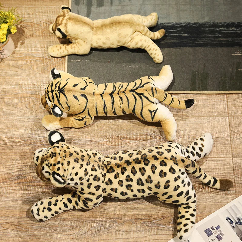Three adorable plush animal toys featuring lifelike designs of wild animals, displayed on a wooden surface. Perfect for play, decor, or as a cuddly companion.
