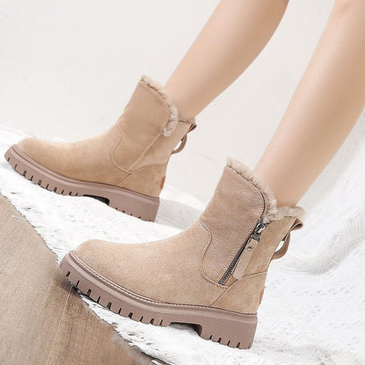 A pair of women's cozy winter boots featuring a soft lining, durable design, and a convenient side zipper for easy wear, perfect for keeping feet warm and stylish during the colder months.