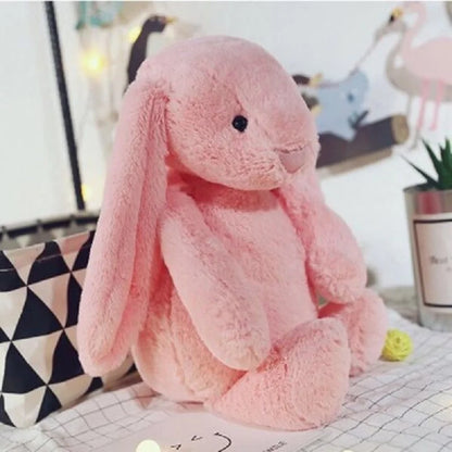 A plush bunny toy with a soft, huggable design and floppy ears, perfect for snuggles, playtime, or as a charming decorative piece for all ages.