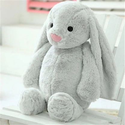 A plush bunny toy with a soft, huggable design and floppy ears, perfect for snuggles, playtime, or as a charming decorative piece for all ages.