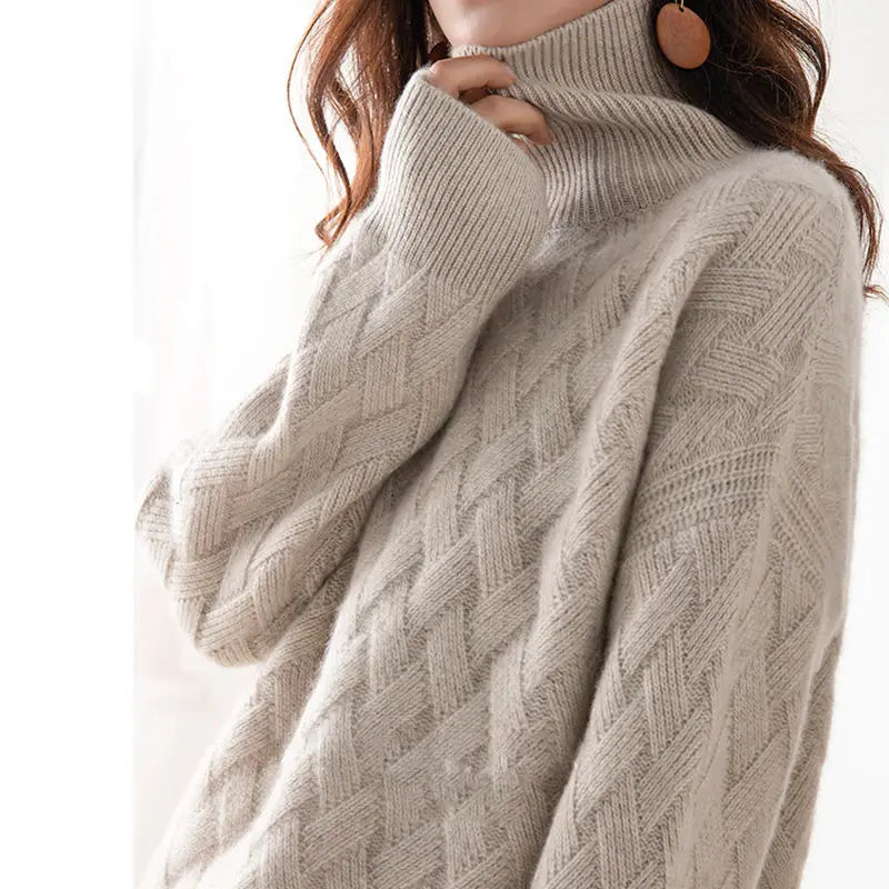 Close-up of a cozy textured knit sweater with a turtleneck design, highlighting the intricate pattern and soft material, perfect for a stylish and warm look.