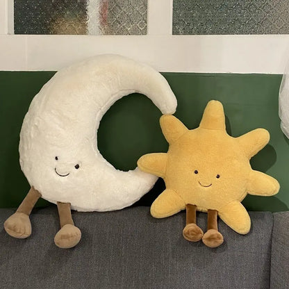 A plush set featuring a cheerful sun and a crescent moon with adorable smiling faces and soft, huggable designs, perfect for snuggles, room decor, or gifting.