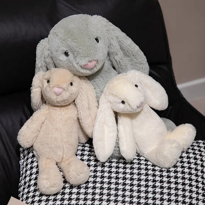 A plush bunny toy with a soft, huggable design, featuring long floppy ears and a charming appearance, perfect for cuddling, playtime, or gifting to loved ones.
