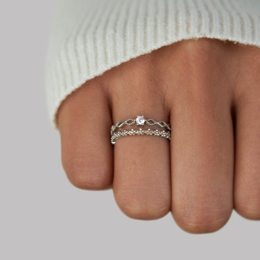 Elegant adjustable ring with intricate detailing and a sparkling centerpiece, showcasing a timeless and sophisticated design.