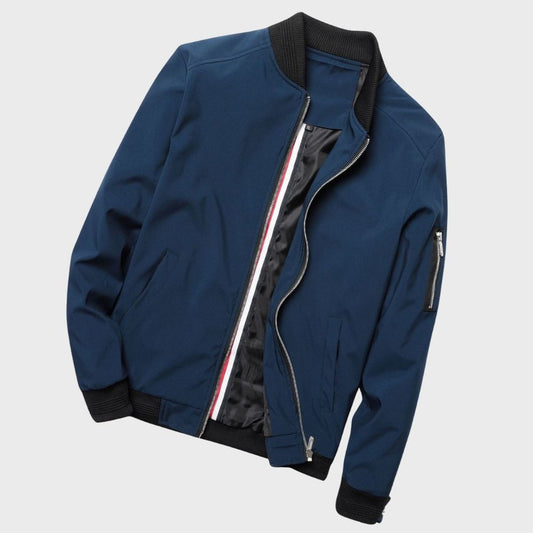 Men's sleek bomber jacket with a modern design, featuring a zip-up front, ribbed cuffs, and a zippered sleeve pocket, styled with a casual outfit for a contemporary look.