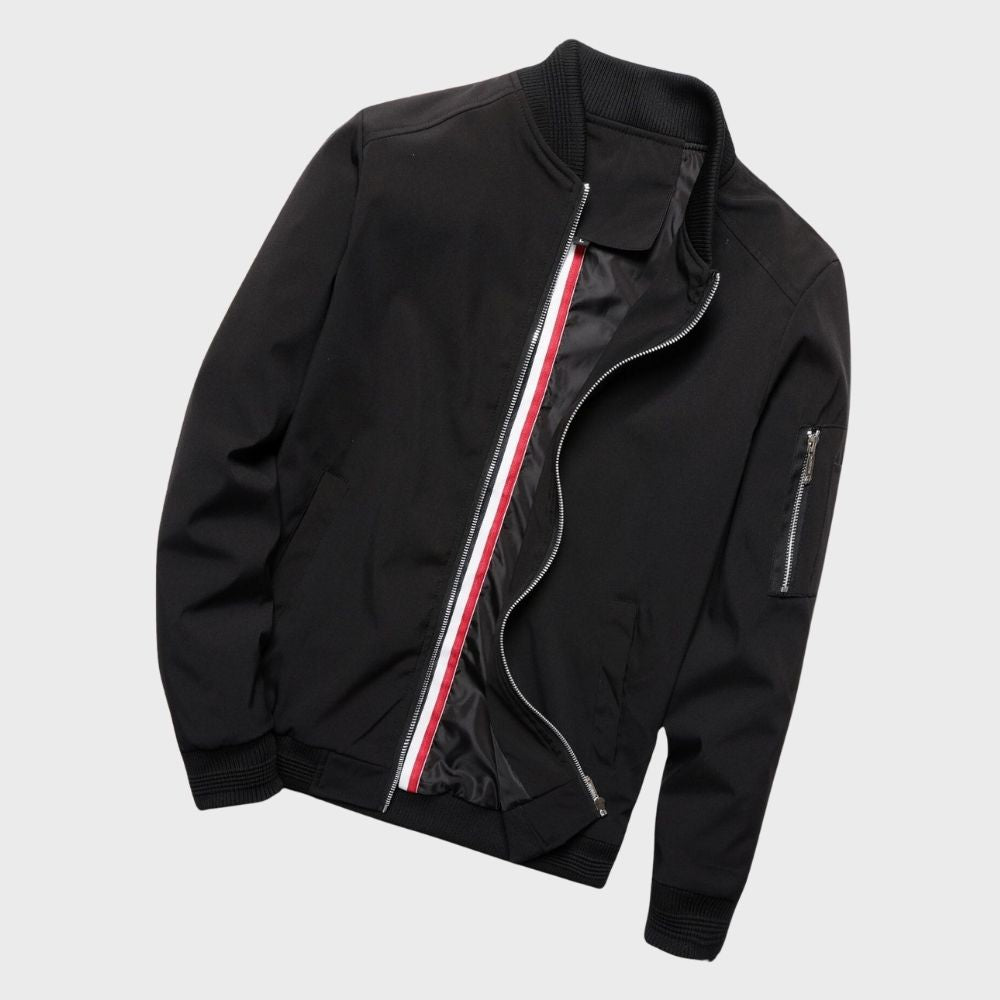 Men's sleek bomber jacket with a modern design, featuring a zip-up front, ribbed cuffs, and a zippered sleeve pocket, styled with a casual outfit for a contemporary look.
