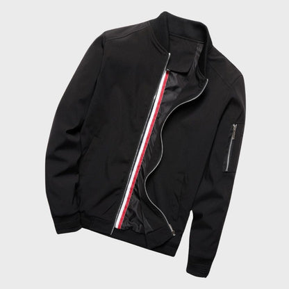 Men's sleek bomber jacket with a modern design, featuring a zip-up front, ribbed cuffs, and a zippered sleeve pocket, styled with a casual outfit for a contemporary look.