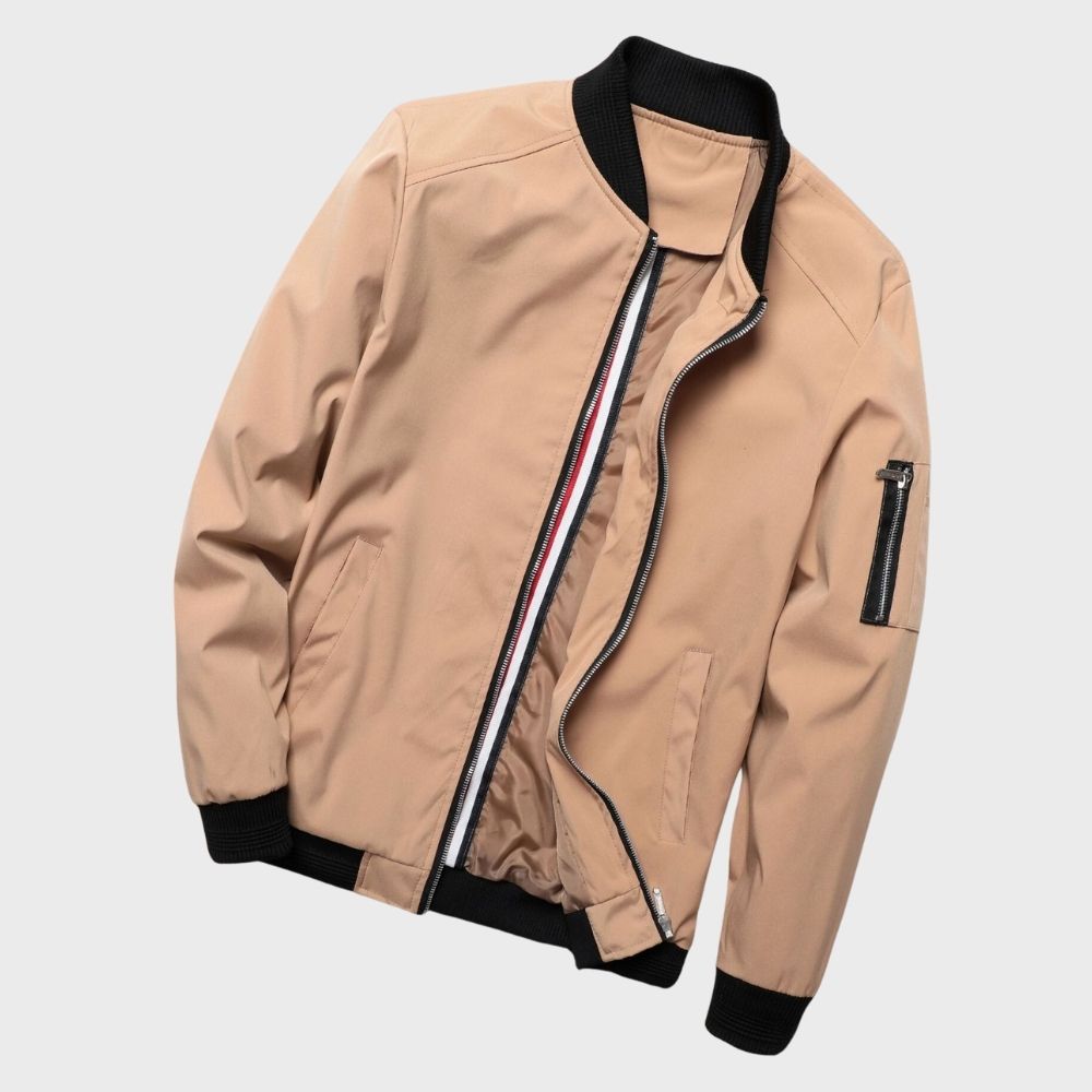 Men's sleek bomber jacket with a modern design, featuring a zip-up front, ribbed cuffs, and a zippered sleeve pocket, styled with a casual outfit for a contemporary look.