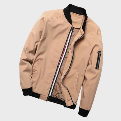 Men's sleek bomber jacket with a modern design, featuring a zip-up front, ribbed cuffs, and a zippered sleeve pocket, styled with a casual outfit for a contemporary look.
