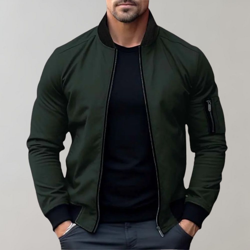 Men's sleek bomber jacket with a modern design, featuring a zip-up front, ribbed cuffs, and a zippered sleeve pocket, styled with a casual outfit for a contemporary look.