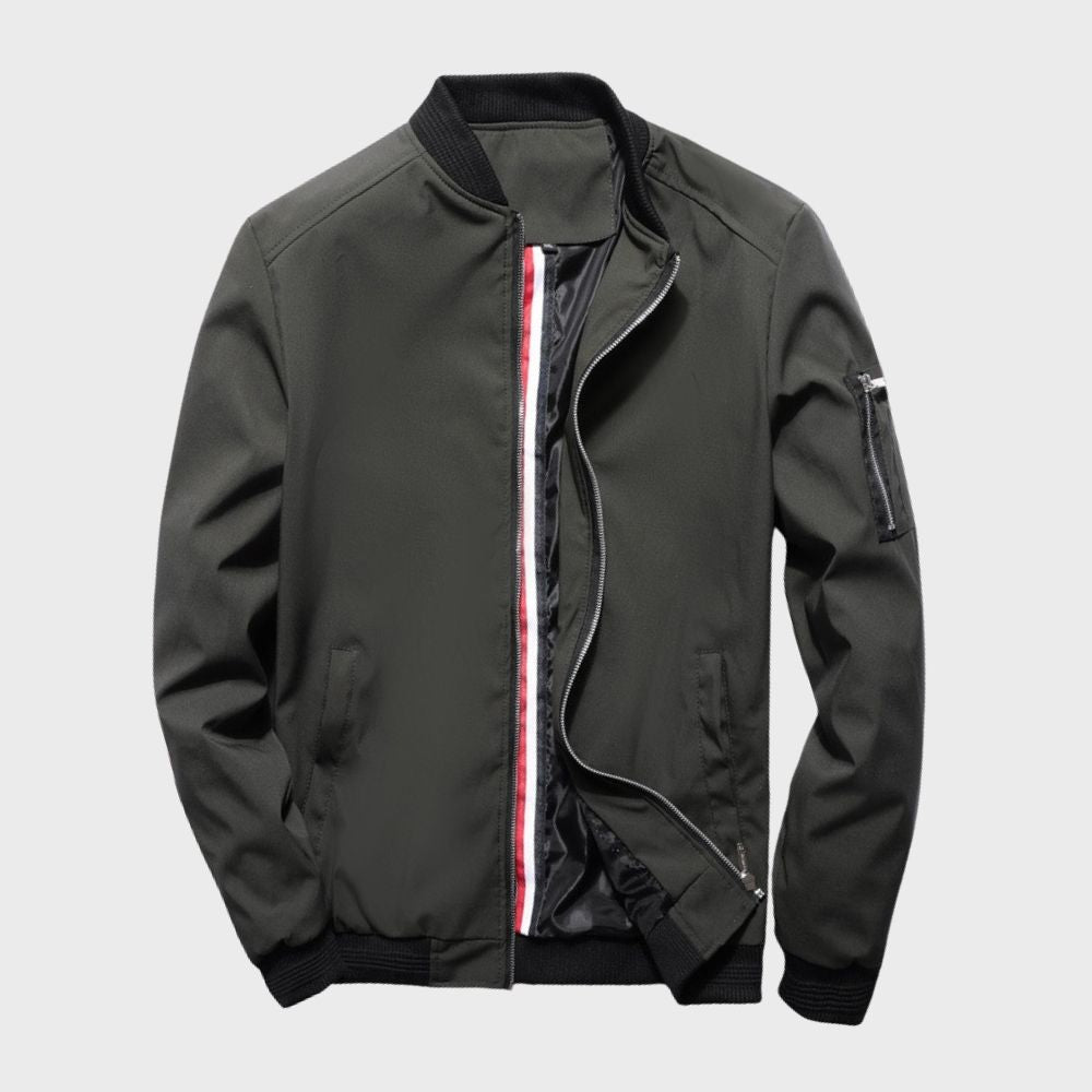 Men's sleek bomber jacket with a modern design, featuring a zip-up front, ribbed cuffs, and a zippered sleeve pocket, styled with a casual outfit for a contemporary look.