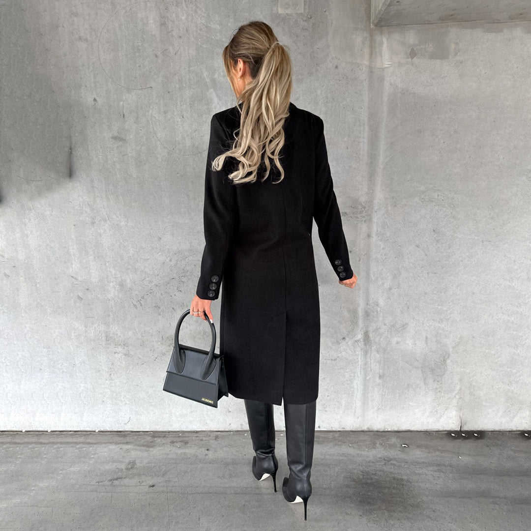 Women's classic long coat featuring a tailored fit, double-breasted buttons, and a chic design, perfect for casual and formal occasions.