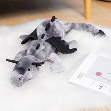 A plush dragon toy featuring a whimsical design with detailed wings and a soft, huggable texture, perfect for playtime, snuggles, or as a unique gift for all ages.
