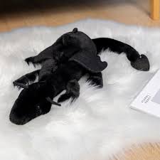 A plush dragon toy featuring a whimsical design with detailed wings and a soft, huggable texture, perfect for playtime, snuggles, or as a unique gift for all ages.