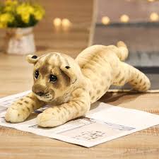 Three adorable plush animal toys featuring lifelike designs of wild animals, displayed on a wooden surface. Perfect for play, decor, or as a cuddly companion.