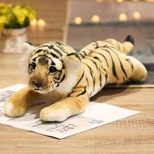 Three adorable plush animal toys featuring lifelike designs of wild animals, displayed on a wooden surface. Perfect for play, decor, or as a cuddly companion.