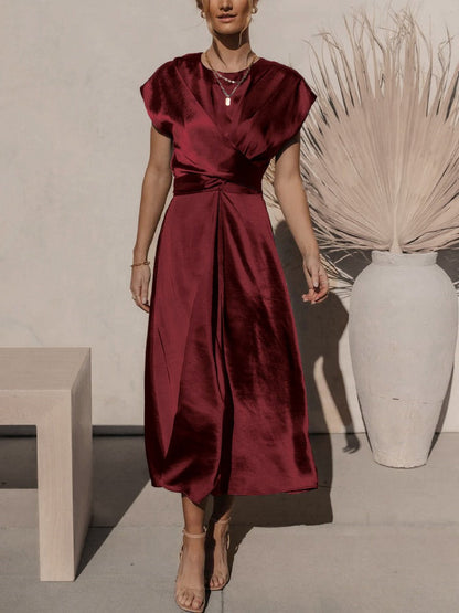 A graceful women's satin wrap dress with an elegant flow, featuring a flattering silhouette and luxurious fabric, perfect for formal occasions or special events.