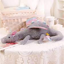 A plush dragon toy featuring a whimsical design with detailed wings and a soft, huggable texture, perfect for playtime, snuggles, or as a unique gift for all ages.