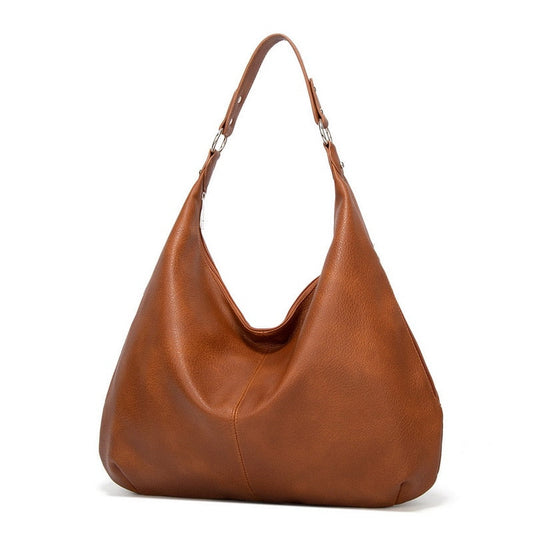A women's sleek shoulder bag with a timeless design, featuring a minimalist look and a spacious interior, perfect for everyday use or special occasions.