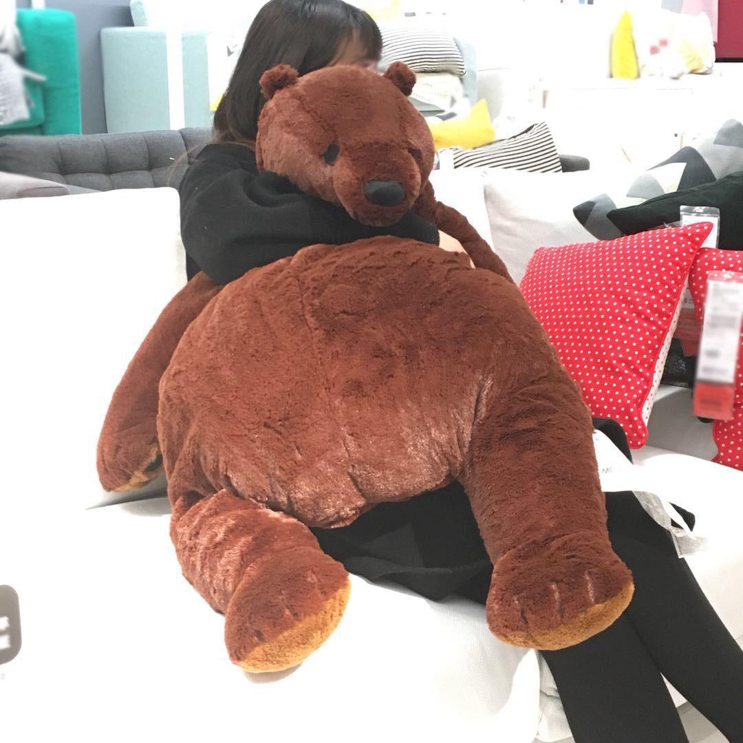A plush bear toy with a cozy and oversized design, perfect for cuddling, adding comfort to any space, or as a unique decorative piece for all ages.