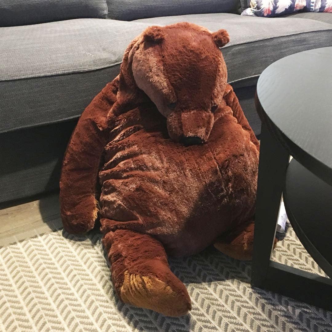 A plush bear toy with a cozy and oversized design, perfect for cuddling, adding comfort to any space, or as a unique decorative piece for all ages.