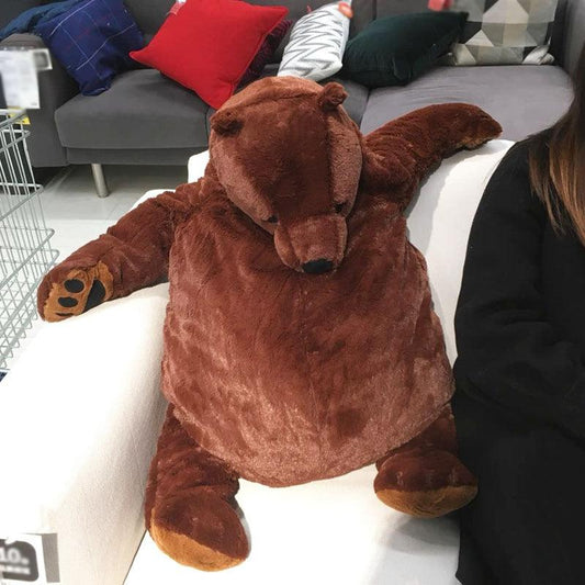 A plush bear toy with a cozy and oversized design, perfect for cuddling, adding comfort to any space, or as a unique decorative piece for all ages.