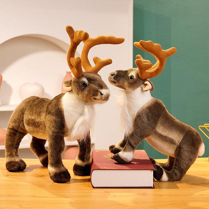 Festive plush reindeer set featuring two reindeer stacked playfully, displayed in a holiday-themed setting with decorations and gifts.