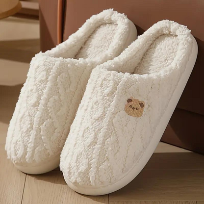 Plush women's slippers with a cozy and soft texture, featuring a comfortable design and non-slip soles, perfect for relaxing at home.