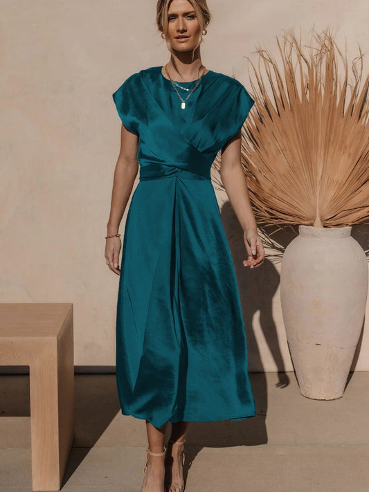 A graceful women's satin wrap dress with an elegant flow, featuring a flattering silhouette and luxurious fabric, perfect for formal occasions or special events.